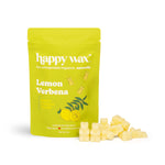 Lime-green pouch of Happy Wax lemon verbena scented soy wax melts with cream-colored wax pieces displayed beside it.