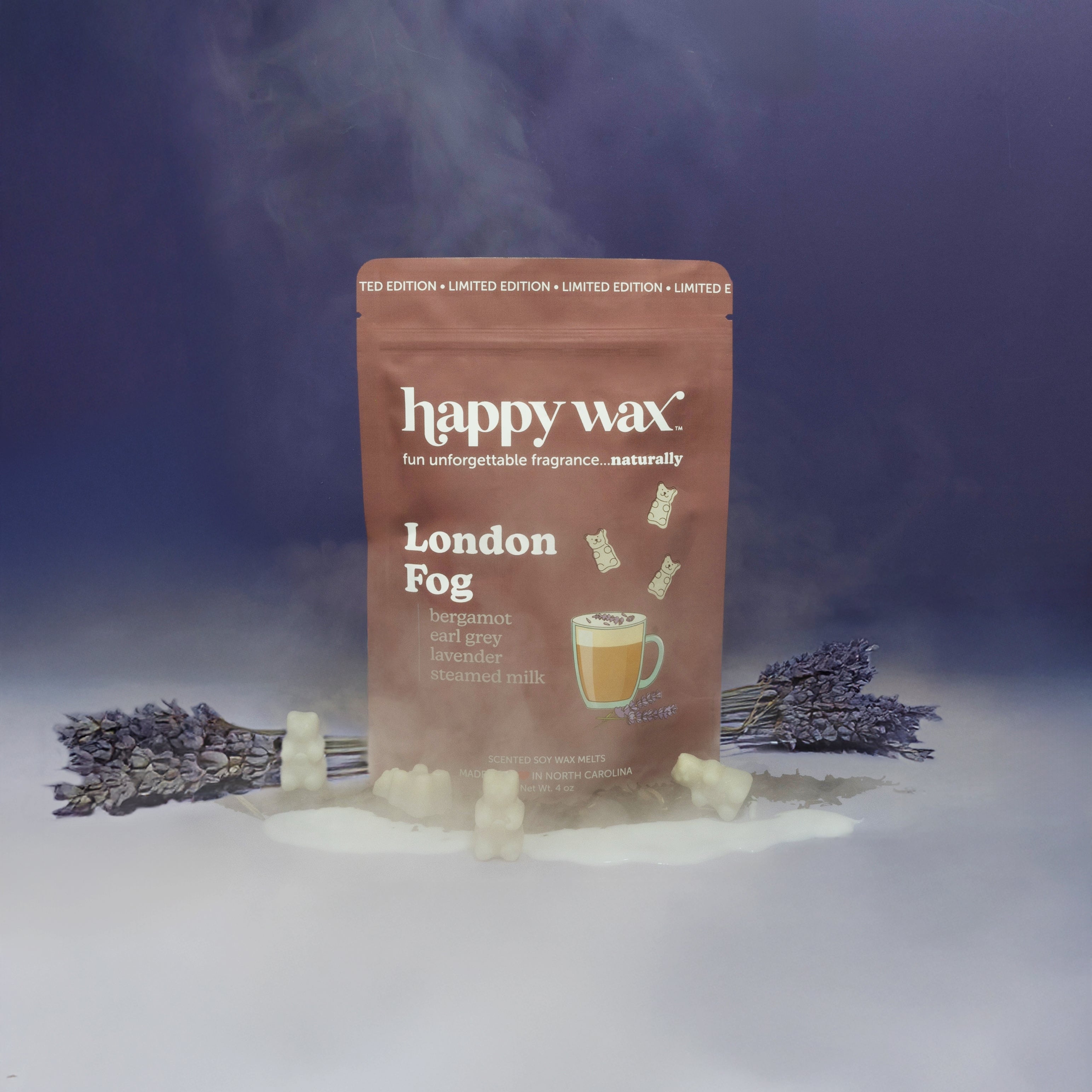 Happy Wax limited edition "London Fog" scented wax melts package with cream-colored wax cubes and dried lavender sprigs on pu