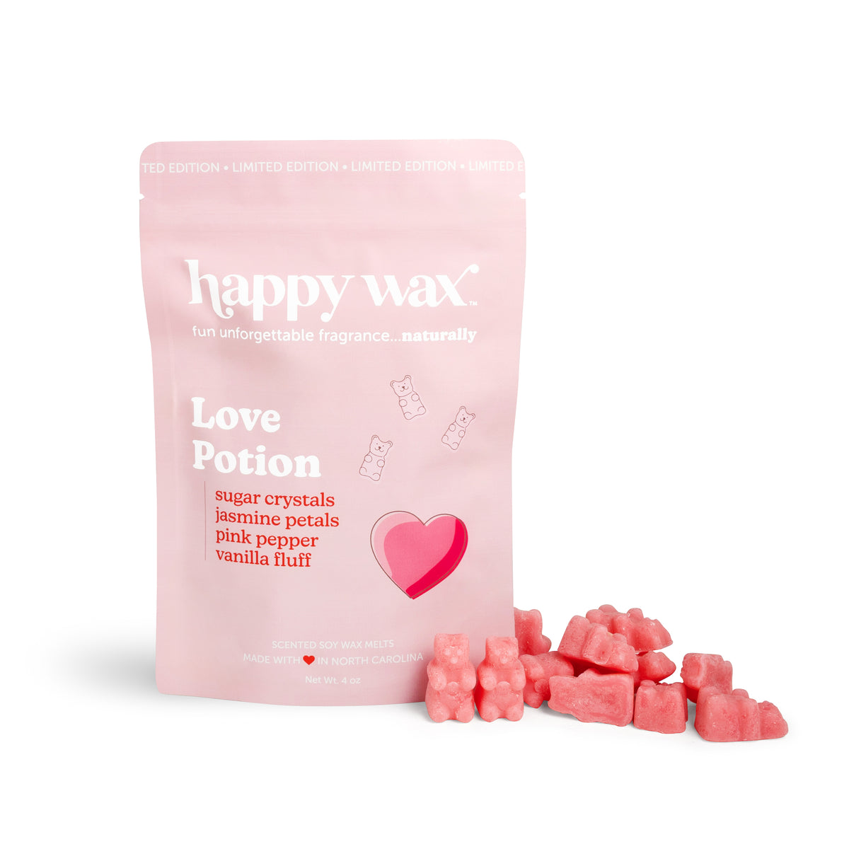 Pink pouch of Happy Wax Love Potion scented wax melts with red heart icon and scattered pink wax chunks beside it.