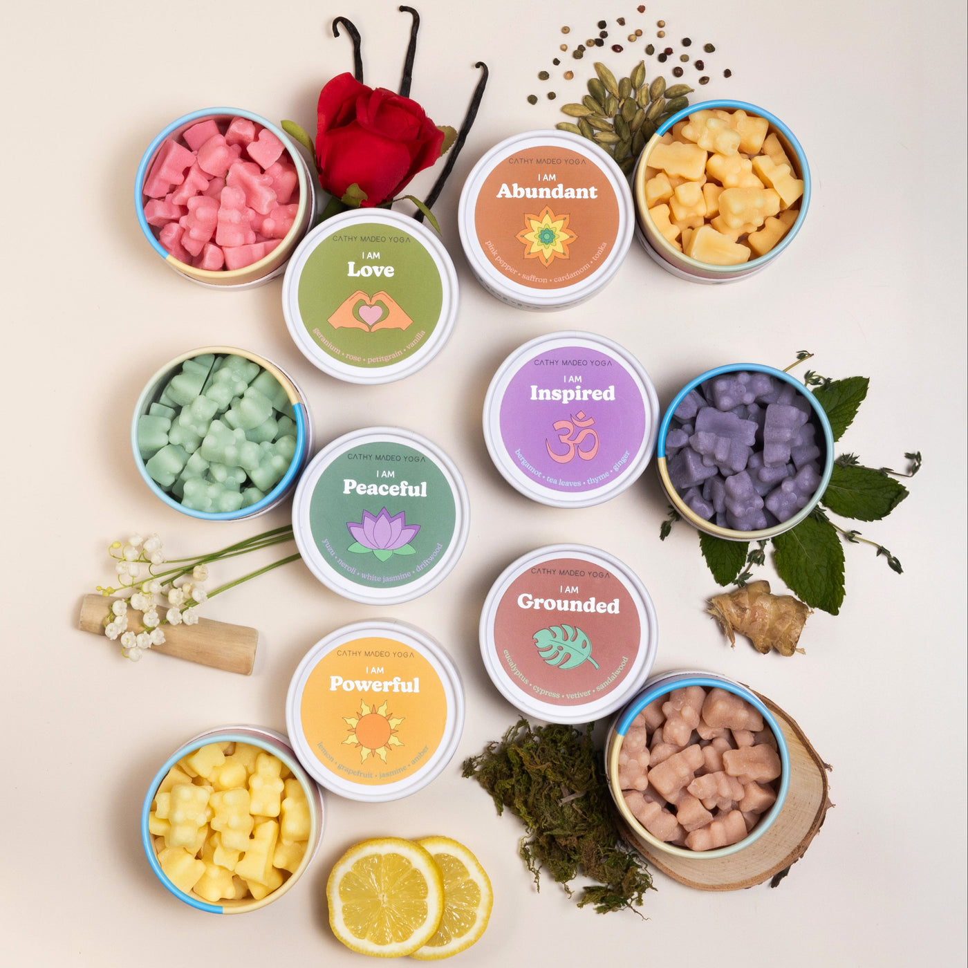 Six scented wax melts in labeled containers with affirmation themes: Love, Abundant, Inspired, Peaceful, Grounded, and Powerf