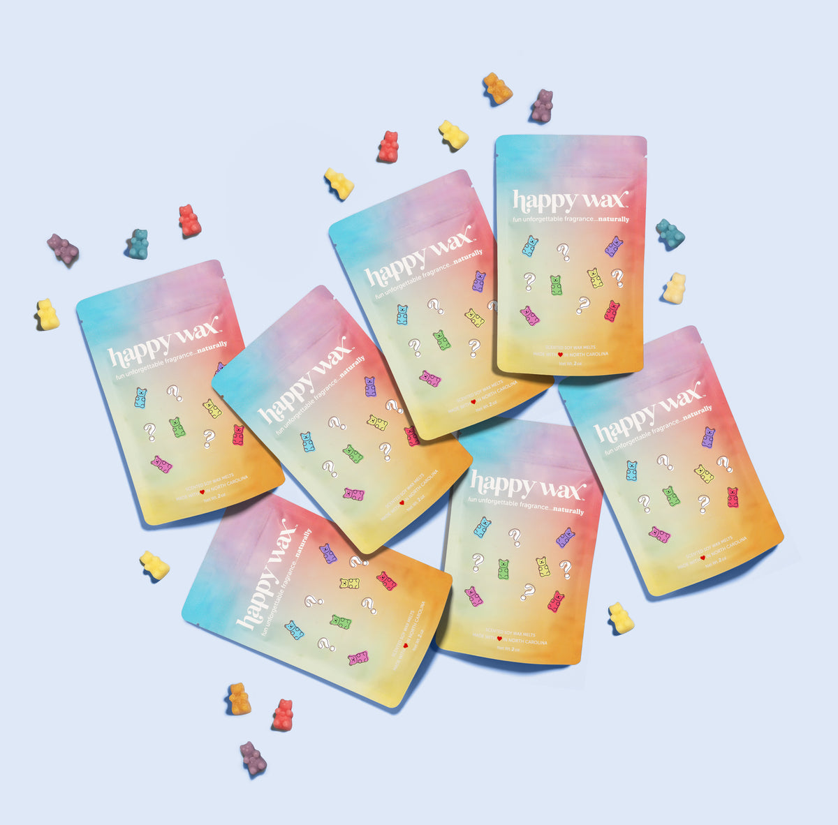 Five Happy Wax gradient pouches with question mark icons and colorful wax pieces scattered around them on a light blue backgr