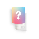 White outlet warmer with gradient-colored top featuring a question mark, mounted on electrical outlet.