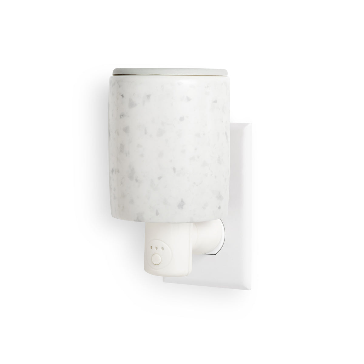 White wax warmer with speckled ceramic vessel and plug-in timer outlet base mounted on wall.