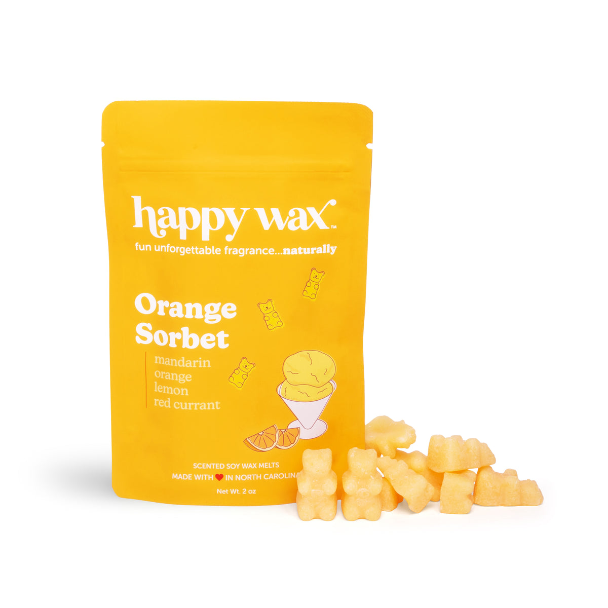 Yellow pouch labeled "Orange Sorbet" with scattered pale yellow wax melts shaped like flowers and stars beside it.