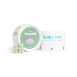 Open white container labeled "I am Peaceful" with green label and lotus flower, next to Happy Wax branded box with pale green