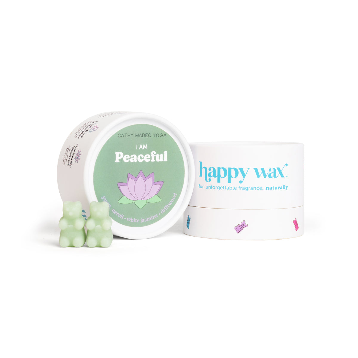 Open white container labeled "I am Peaceful" with green label and lotus flower, next to Happy Wax branded box with pale green