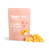 Happy Wax Peaches & Cream wax melts packaging with orange bear shaped wax melts on a white background