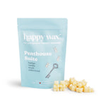 Light blue pouch of happy wax Penthouse Suite wax melts with cream-colored wax cubes displayed beside it.