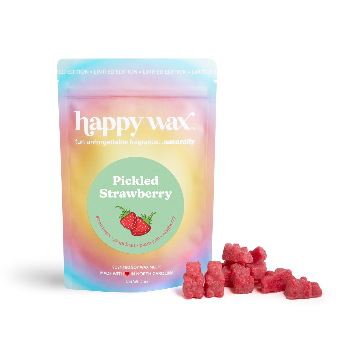 Pink wax melts next to a rainbow gradient pouch labeled "Pickled Strawberry" with strawberry illustration.