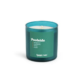Teal glass candle with white wax and single wick, labeled "Poolside" with scent notes of bergamot, mandarin, violet, and musk