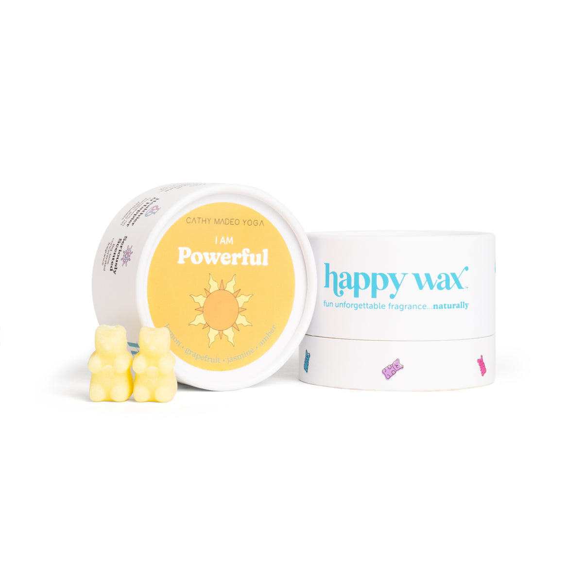 Yellow wax melts with bear-shaped pieces next to open container labeled "I am Powerful" with sun design and happy wax packagi