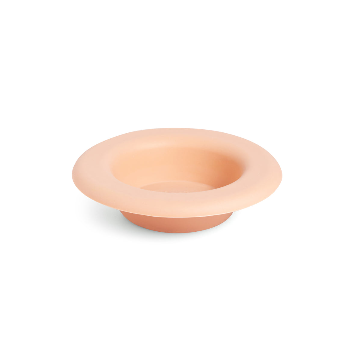 Peach-colored silicone wax melt dish with wide rim and circular center well.