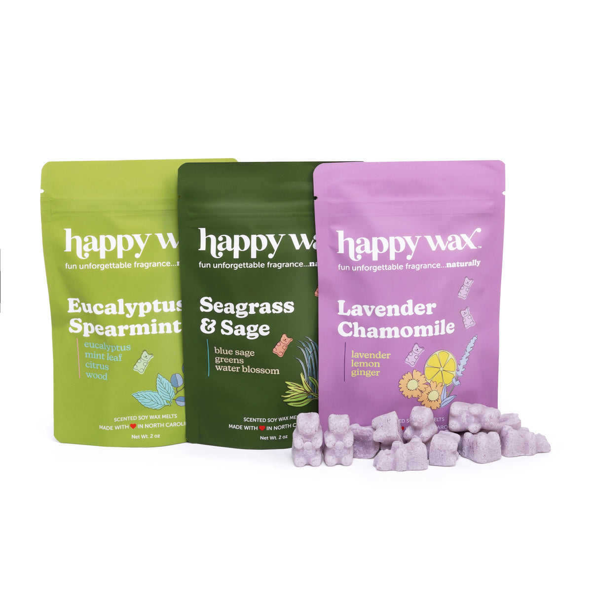 Three pouches of Happy Wax scented soy wax melts in Eucalyptus Spearmint, Seagrass & Sage, and Lavender Chamomile with loose 