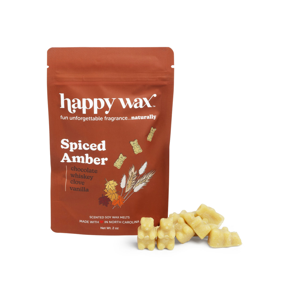 Terracotta pouch of Happy Wax brand Spiced Amber wax melts with pale yellow wax melts displayed beside it.