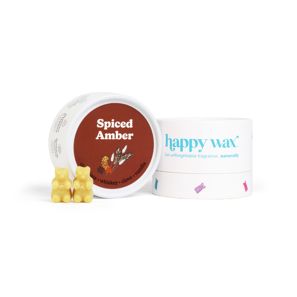 Yellow bear-shaped wax melts next to a white container labeled "happy wax" and a brown lid labeled "Spiced Amber."