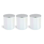Three white cylindrical wax melt jars with silver metallic lids.