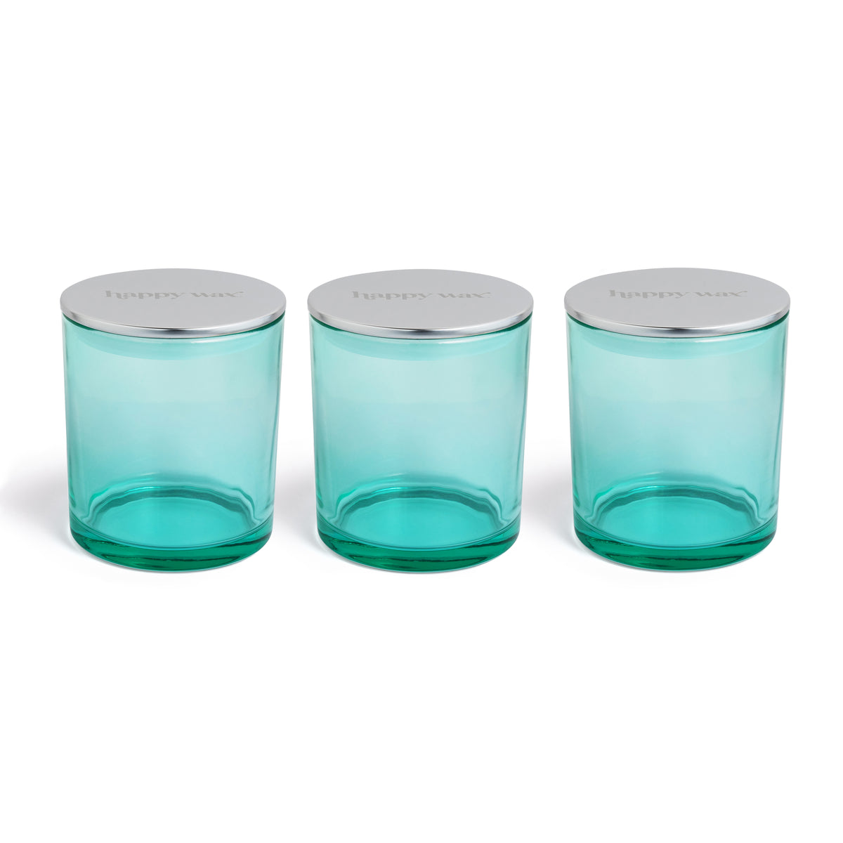 Three turquoise glass jars with silver metal lids arranged in a row.
