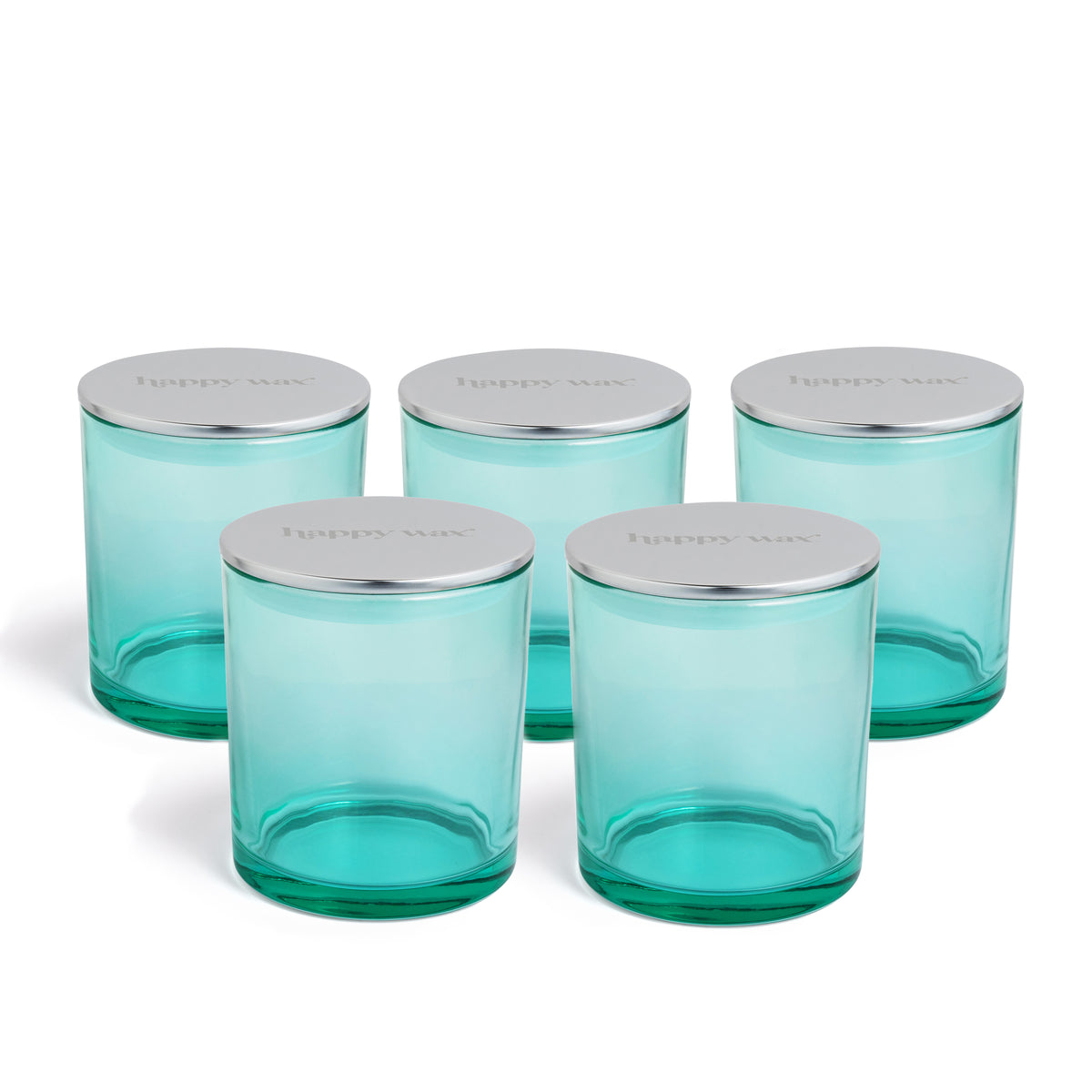 Five turquoise glass jars with silver metal lids arranged in a group.