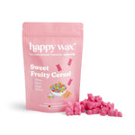 Pink pouch of happy wax brand wax melts with colorful cereal bowl illustration, surrounded by pink wax melt pieces.