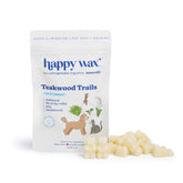 White pouch of Happy Wax Teakwood Trails pet wax melts with cream-colored wax pieces displayed in front.