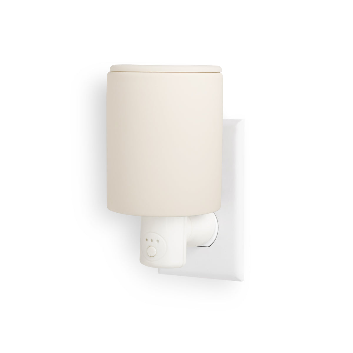 White ceramic wax warmer with plug-in base and timer control mounted on wall outlet.
