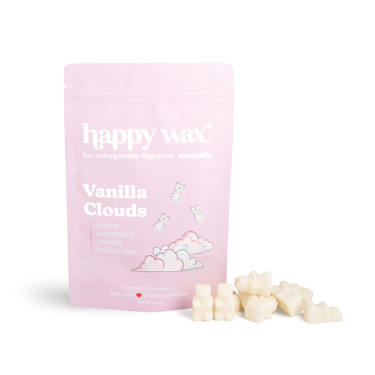 Pink pouch labeled "happy wax Vanilla Clouds" with cream-colored wax melts displayed beside it.