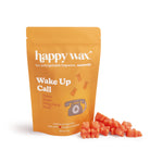 Orange pouch of Happy Wax Wake Up Call soy wax melts with red cube-shaped wax pieces displayed beside it.