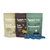 Three Happy Wax pouches in cream, brown, and green with Desert Torchwood, Palo Santo, and Moonshadow scents, displayed with b
