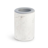 Cylindrical wax warmer with white marble texture and gray rim on top.