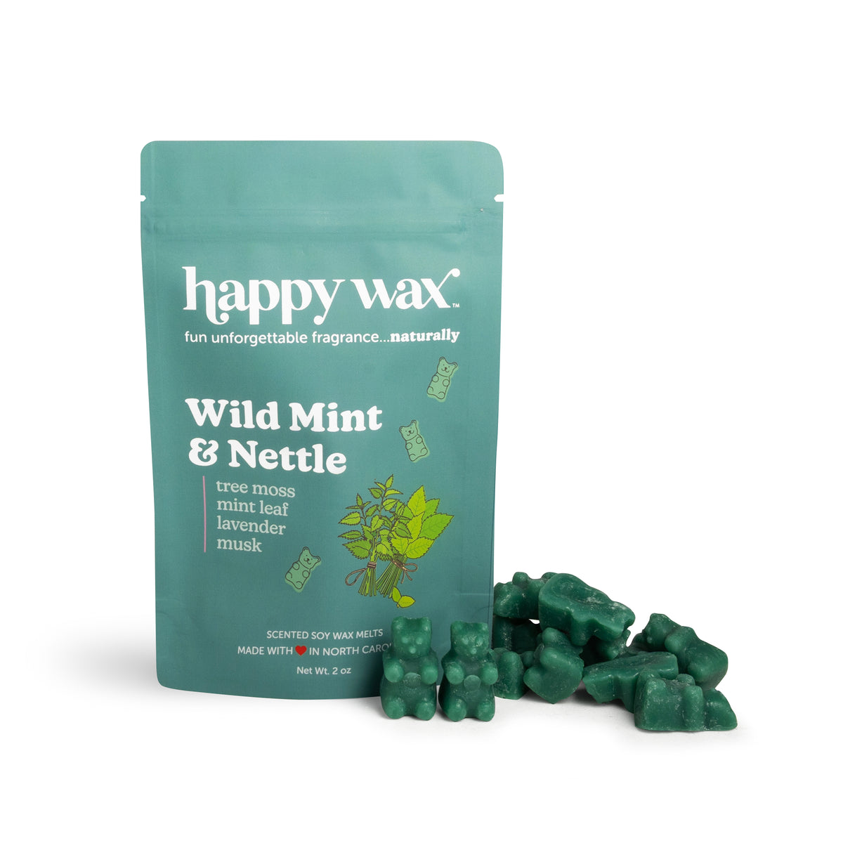 Green wax melts next to teal Happy Wax brand pouch labeled Wild Mint & Nettle.