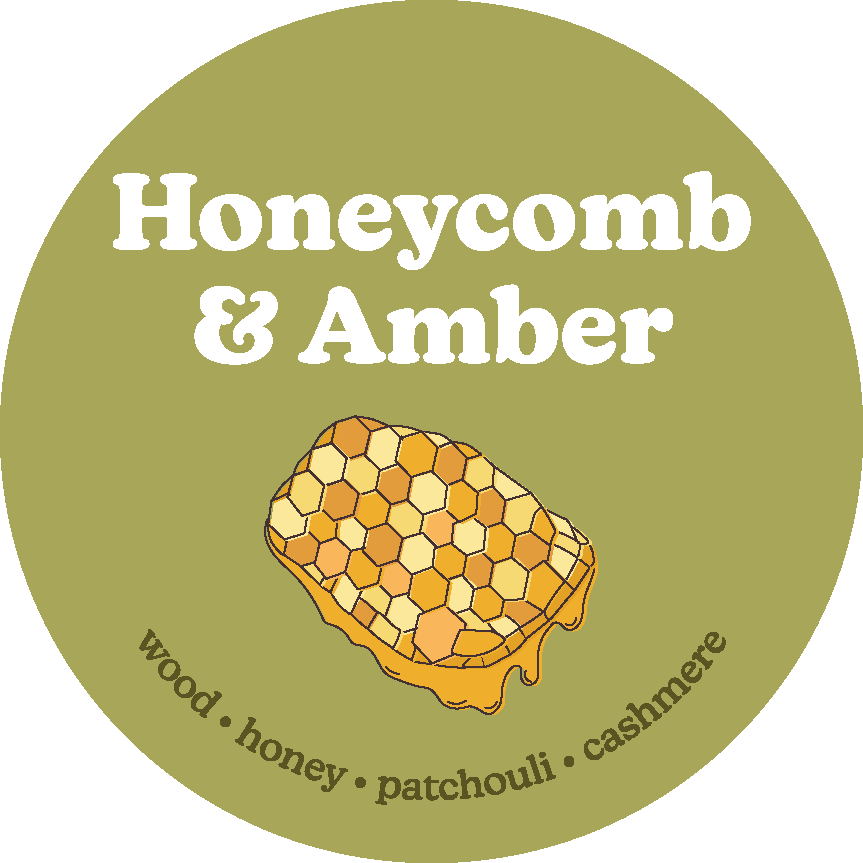 Circular olive-green label with white text reading "Honeycomb & Amber" and illustrated honeycomb with dripping honey in cente