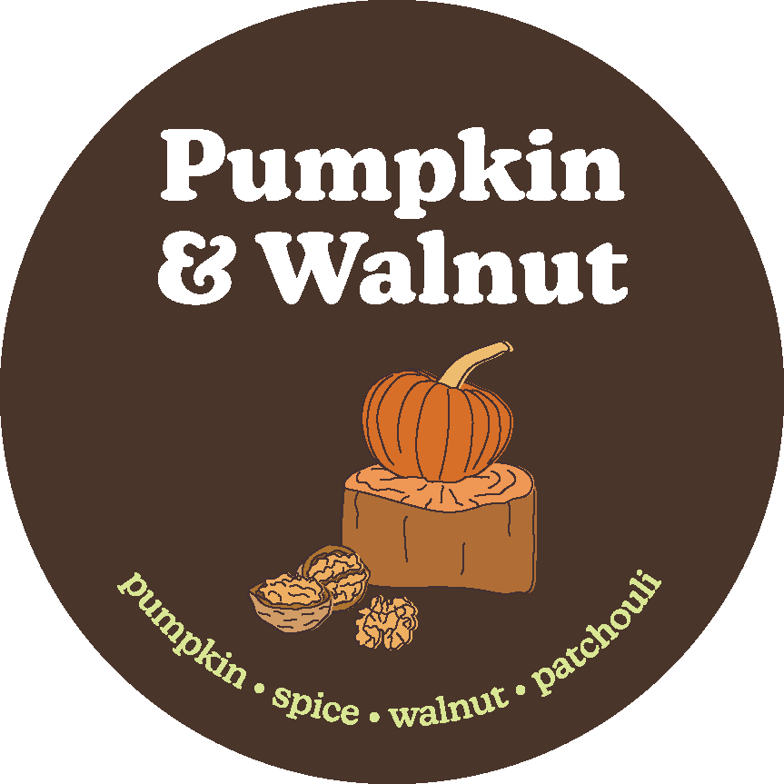 Brown circular label with white text reading "Pumpkin & Walnut" and illustrated pumpkin on wooden block with walnuts below.