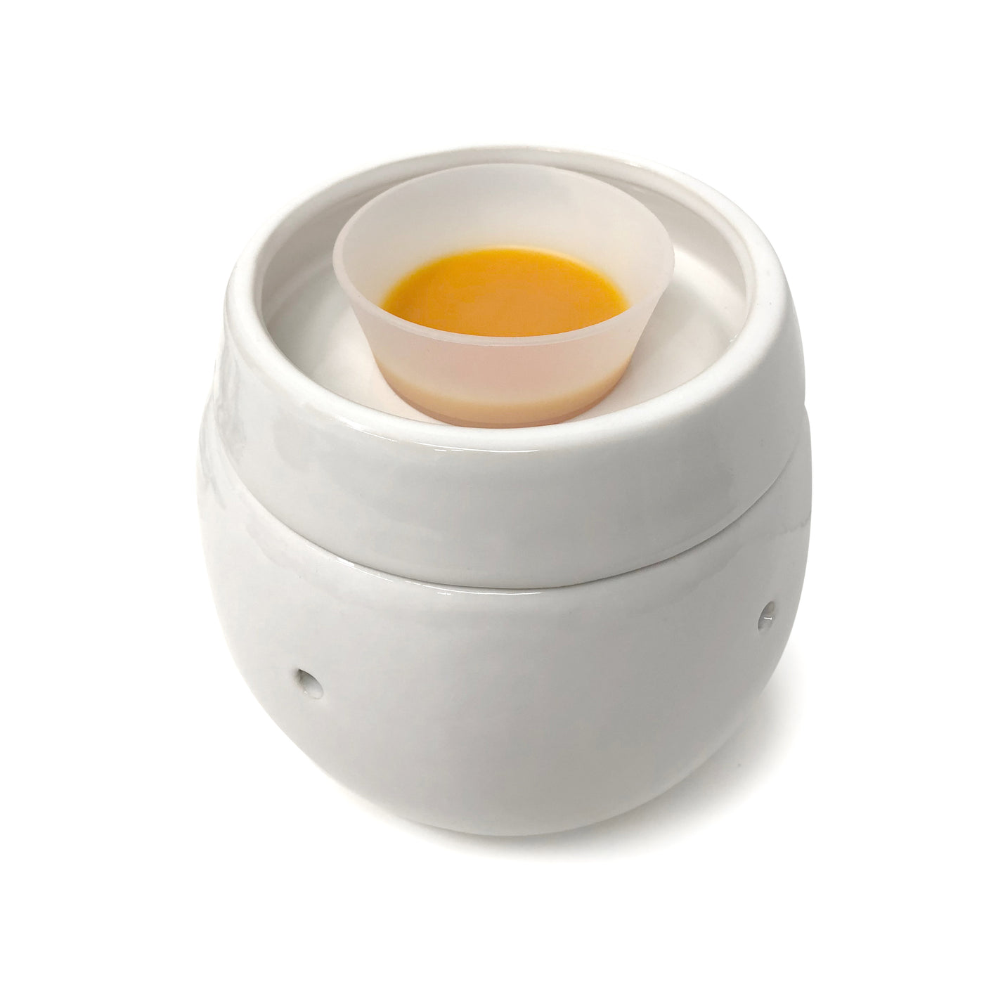 White wax warmer with clear removable liner bowl containing yellow wax inside.