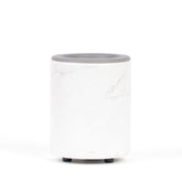 Cylindrical wax warmer with white marble-textured body, gray rim top, and black feet.